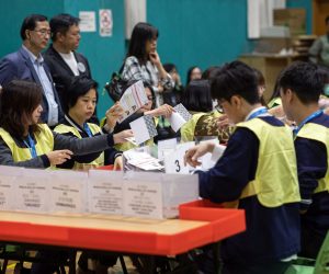 epa08022342 Staff from the Registration and Electoral Office count votes during the District Council Ordinary Election in Hong Kong, China, 24 November 2019. According to reports at least 2.8 million people voted on 24 November in the city's first election since the outbreak of widespread anti-government protests in June 2019.  EPA/JEROME FAVRE