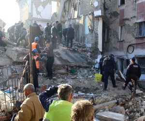 epa08026369 A rescue team searches the rubble of a building for survivors after an earthquake hit Thumane, Albania, 25 November 2019. Albania was hit by a 6.4 magnitude earthquake on 26 November 2019, leaving three people dead and dozens injured.  EPA/MALTON DIBRA