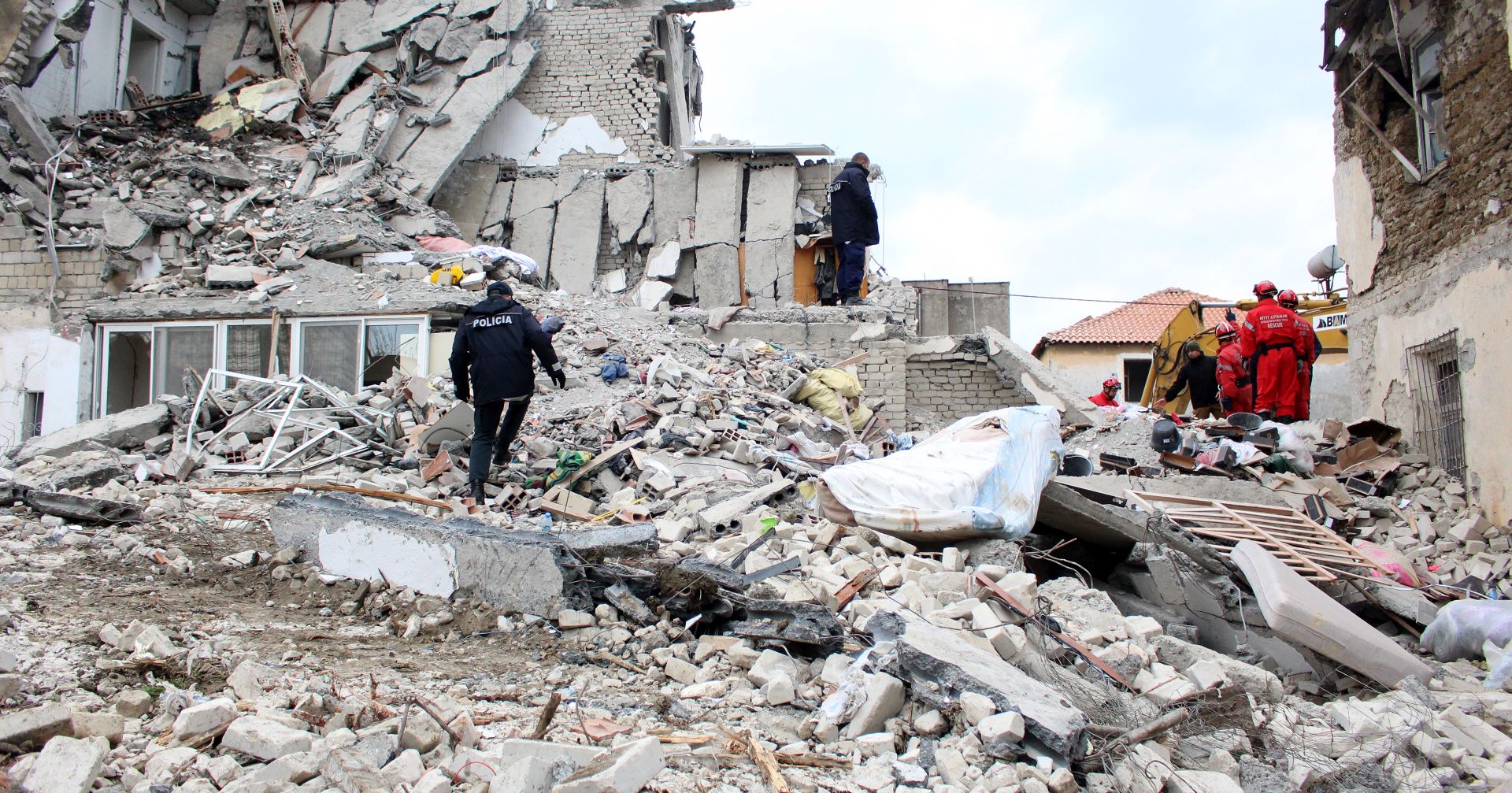epa08028517 Rescue teams for Natural Disasters from Serbia search for victims in the rubbles of a building after the earthquake in Thumane, Albania, 27 November 2019. Over two hundreed specialist from the EU has arrived in Albania to help after Albania was hit by a 6.4 magnitude earthquake on 26 November 2019, leaving until now over 30 people dead and 200 injured.  EPA/MALTON DIBRA