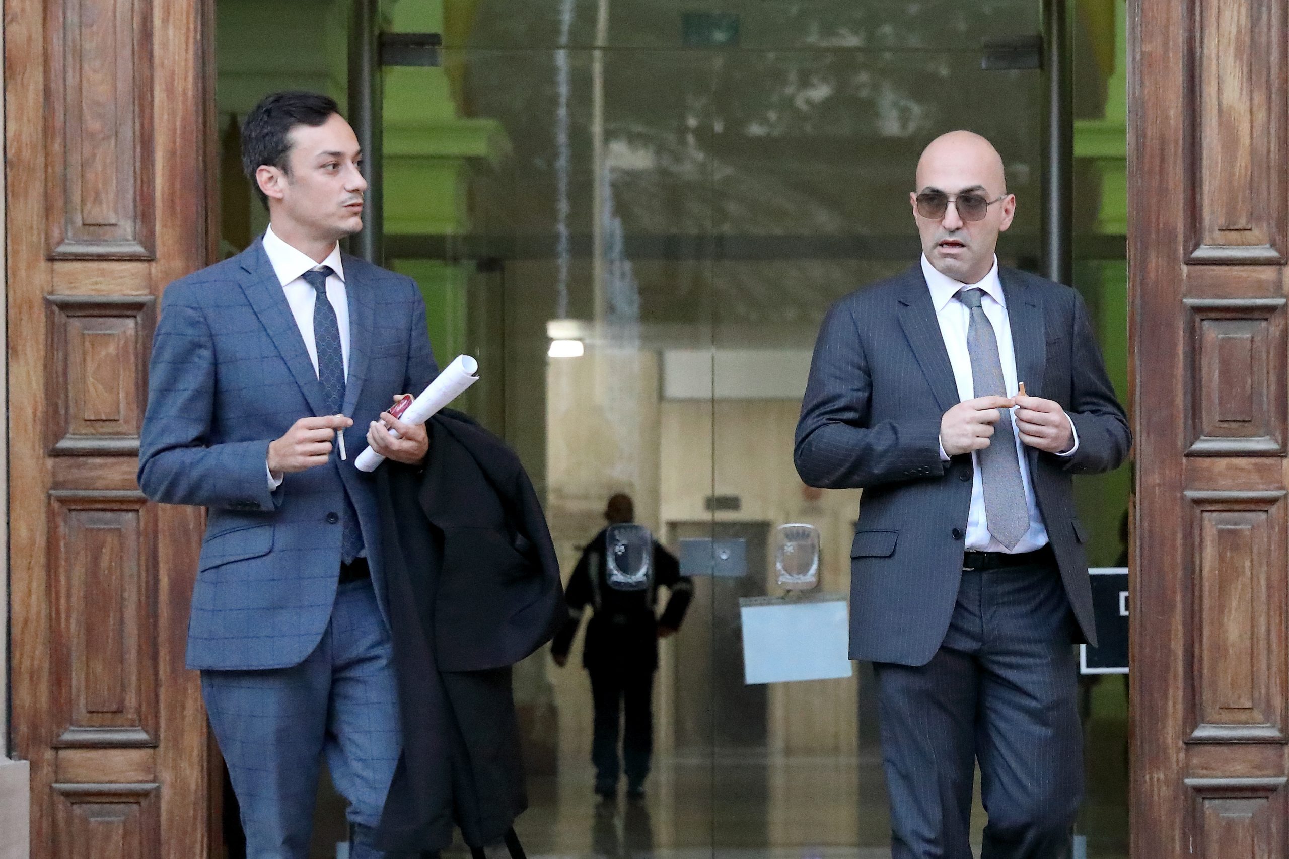 epa08033564 Entrepreneur Yorgen Fenech (R) leaves with an unidentified man the Malta Law Courts, in Valletta, Malta, 29 November, 2019. Fenech's lawyers request to have the chief investigator in the Daphne Caruana Glizia murder case removed.  Maltese authorities had arrested Yorgen Fenech on 20 November as a person of interest in investigations into the October 2017 car bomb murder of Maltese journalist Daphne Caruana Galizia.  EPA/DOMENIC AQUILINA