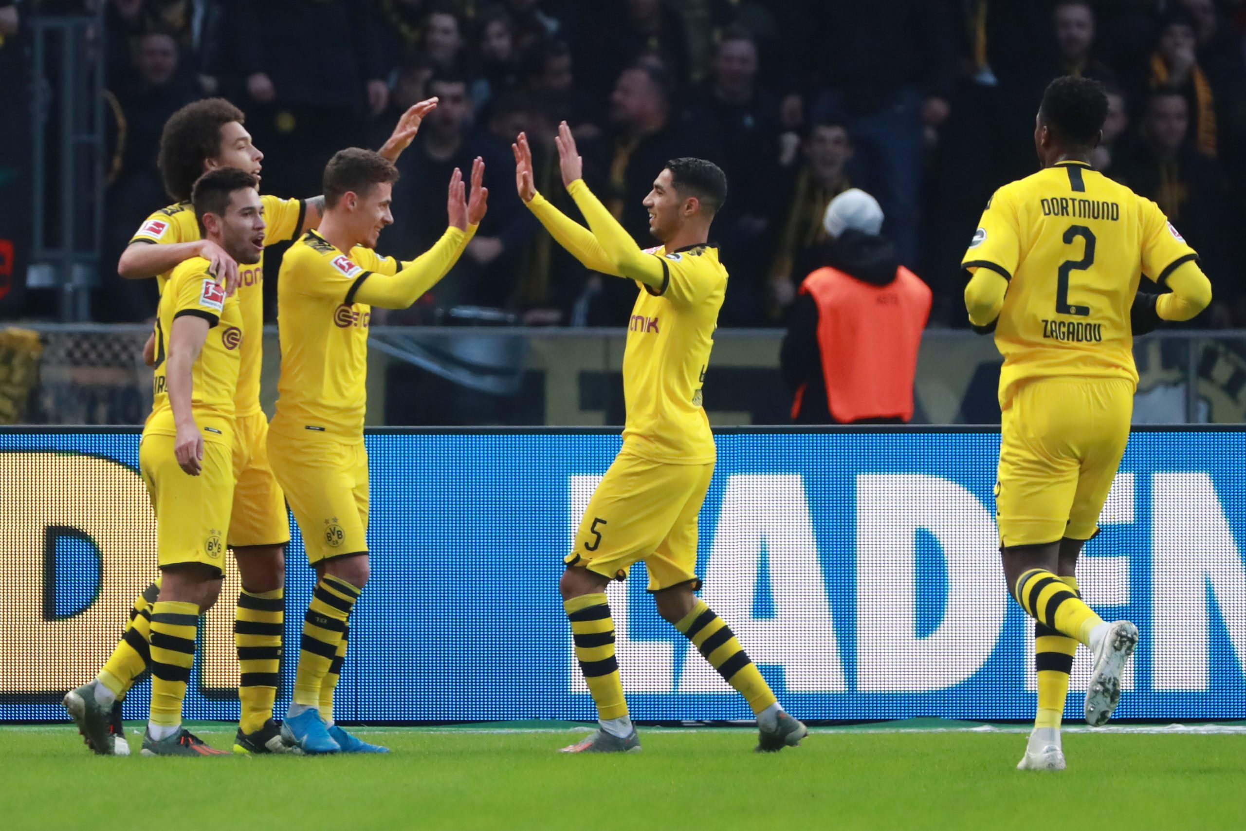 epa08035101 Dortmund's Thorgan Hazard (C) celebrates after scoring the 0:2 during the German Bundesliga soccer match between Hertha BSC and Borussia Dortmund in Berlin, Germany, 30 November 2019.  EPA/HAYOUNG JEON CONDITIONS - ATTENTION: The DFL regulations prohibit any use of photographs as image sequences and/or quasi-video.