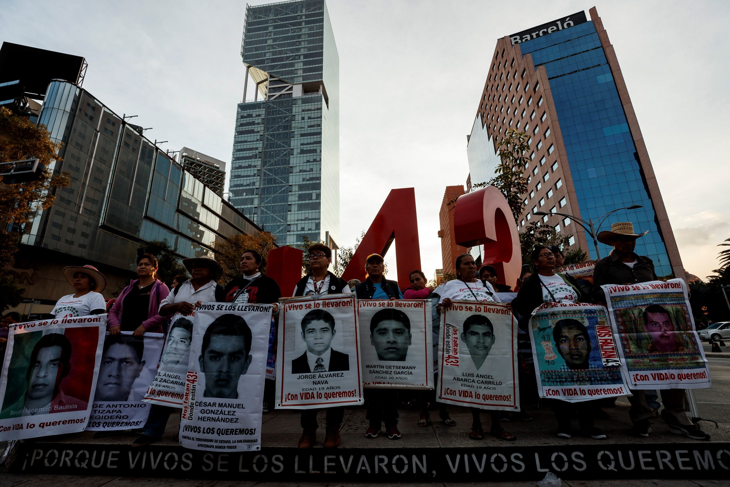 epa08028129 Parents of the 43 missing students from the Ayotzinapa Rural Teacher's College, accompanied by students and members of civil organizations, protest in Mexico City, Mexico, 26 November 2019. The protest comes on the eve of the fifth anniversary of the dissapearance of the students, who were allegedly detained by police and handed over to drug cartel gunmen, in the municipality of Iguala in the southern state of Guerrero.  EPA/JOSE MENDEZ