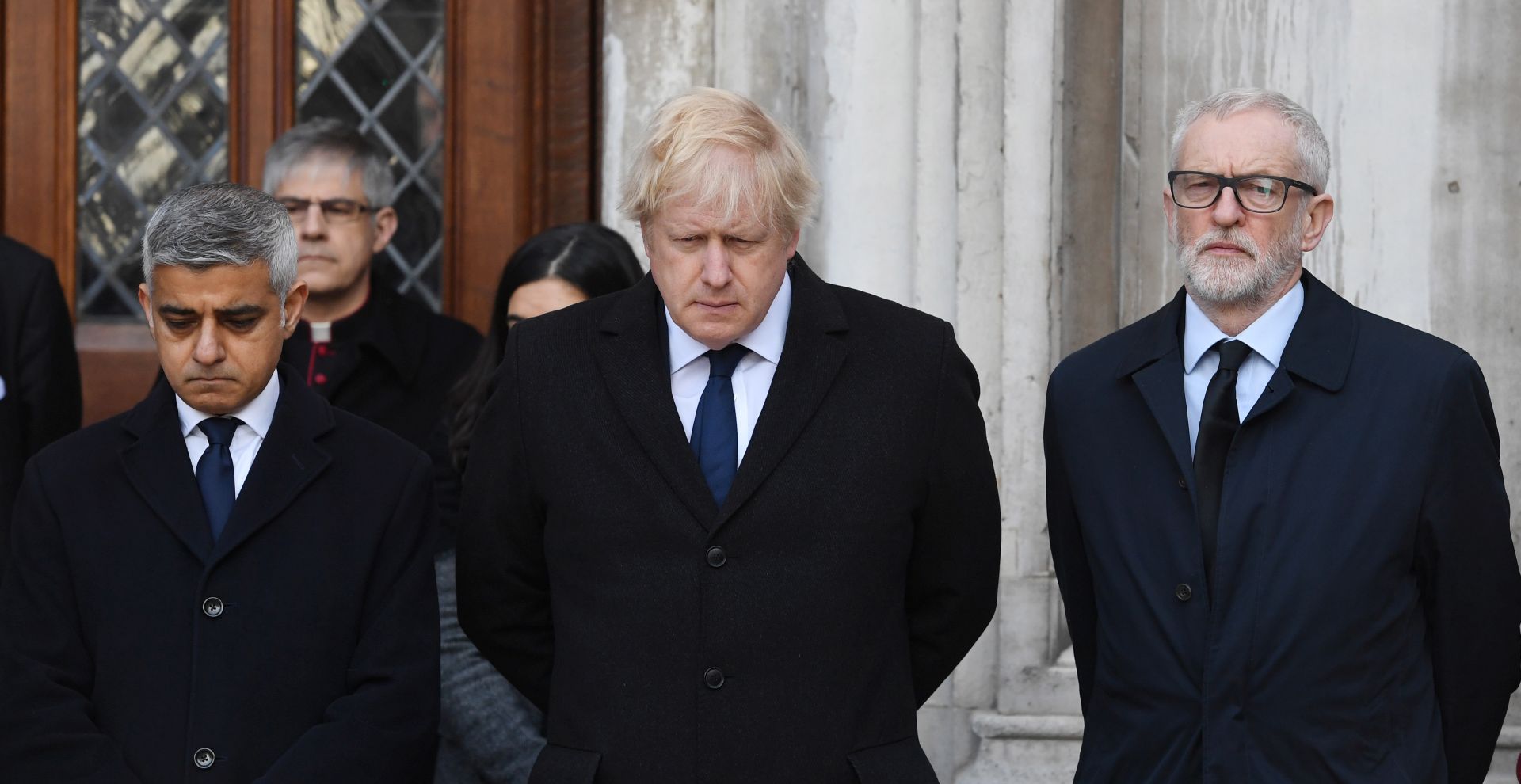 epa08039281 Mayor of London, Sadiq Khan (L), Britain's Prime Minister Boris Johnson (C) and Labour party leader Jeremy Corbyn (R) take part in a vigil at the Guildhall  to pay tribute to the victims of the London Bridge terror attack in London, Britain, 02 December 2019. Two members of the public have died and a male suspect has been shot dead by police at a scene on 29 November after a stabbing at London Bridge.  EPA/FACUNDO ARRIZABALAGA