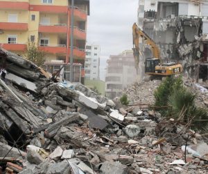 epa08039979 An excavator works at a damaged building in Durres, Albania, 02 December 2019. Albania was hit by a 6.4 magnitude earthquake on 26 November 2019, the strongest recorded in decades, leaving at least 51 people dead and over 250 buildings damaged.  EPA/Malton Dibra