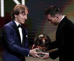 epa08040261 Barcelona forward Lionel Messi (R) wins the Men's 2019 Ballon d'Or and receives the award from the 2018 winner Luka Modric at the Ballon d'Or ceremony at Theatre du Chatelet in Paris, France, 02 December 2019.  EPA/YOAN VALAT