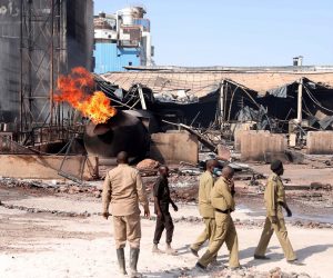 epa08041554 Soldiers and people inspect the site of a tile manufacturing unit after an explosion in an industrial zone, north Khartoum, Sudan, 03 December 2019. According to media reports quoting medical sources, at least 15 people were killed and more than 90 injured in an explosion at tile factory in Khartoum. The cause of explosion was not immediately clear.  EPA/MARWAN ALI