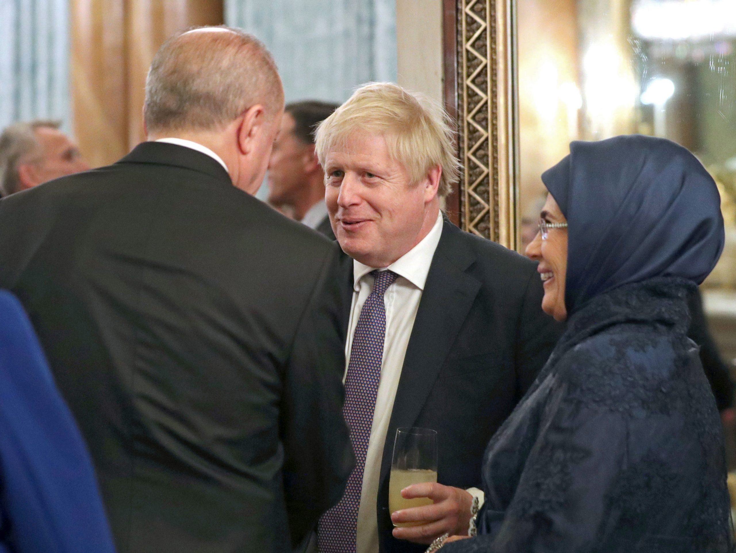 epa08042085 Britain's Prime Minister Boris Johnson (C) talks with Turkish President Recep Tayyip Erdogan (L) and his wife Emine (R) during a reception at Buckingham Palace, London, as leaders gather to mark 70 years of the alliance during the NATO Summit in London, Britain, 03 December 2019. NATO countries' heads of states and governments gather in London for a two-day meeting.  EPA/Yui Mok / POOL