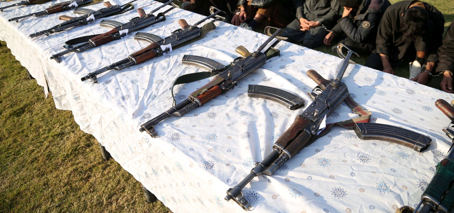 epa08046512 Former militants surrender their weapons during a reconciliation ceremony in Jalalabad, Afghanistan, 05 December 2019. A group of 180 former Taliban and Islamic State (IS) members on 05 December laid down their arms in Jalalabad and joined the peace process. Under an amnesty launched by former President Hamid Karzai and backed by the US in November 2004, hundreds of anti-government militants have surrendered to the government.  EPA/GHULAMULLAH HABIBI