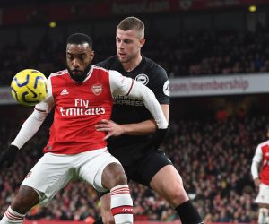 epa08047507 Arsenal's Alexandre Lacazette (L) vies for the ball with Brighton's Dale Stephens (R) during the English Premier League soccer match Arsenal v Brighton in London, Britain, 05 December 2019.  EPA/ANDY RAIN EDITORIAL USE ONLY. No use with unauthorized audio, video, data, fixture lists, club/league logos or 'live' services. Online in-match use limited to 120 images, no video emulation. No use in betting, games or single club/league/player publications