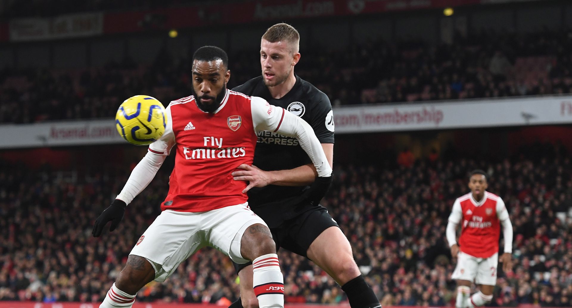 epa08047507 Arsenal's Alexandre Lacazette (L) vies for the ball with Brighton's Dale Stephens (R) during the English Premier League soccer match Arsenal v Brighton in London, Britain, 05 December 2019.  EPA/ANDY RAIN EDITORIAL USE ONLY. No use with unauthorized audio, video, data, fixture lists, club/league logos or 'live' services. Online in-match use limited to 120 images, no video emulation. No use in betting, games or single club/league/player publications