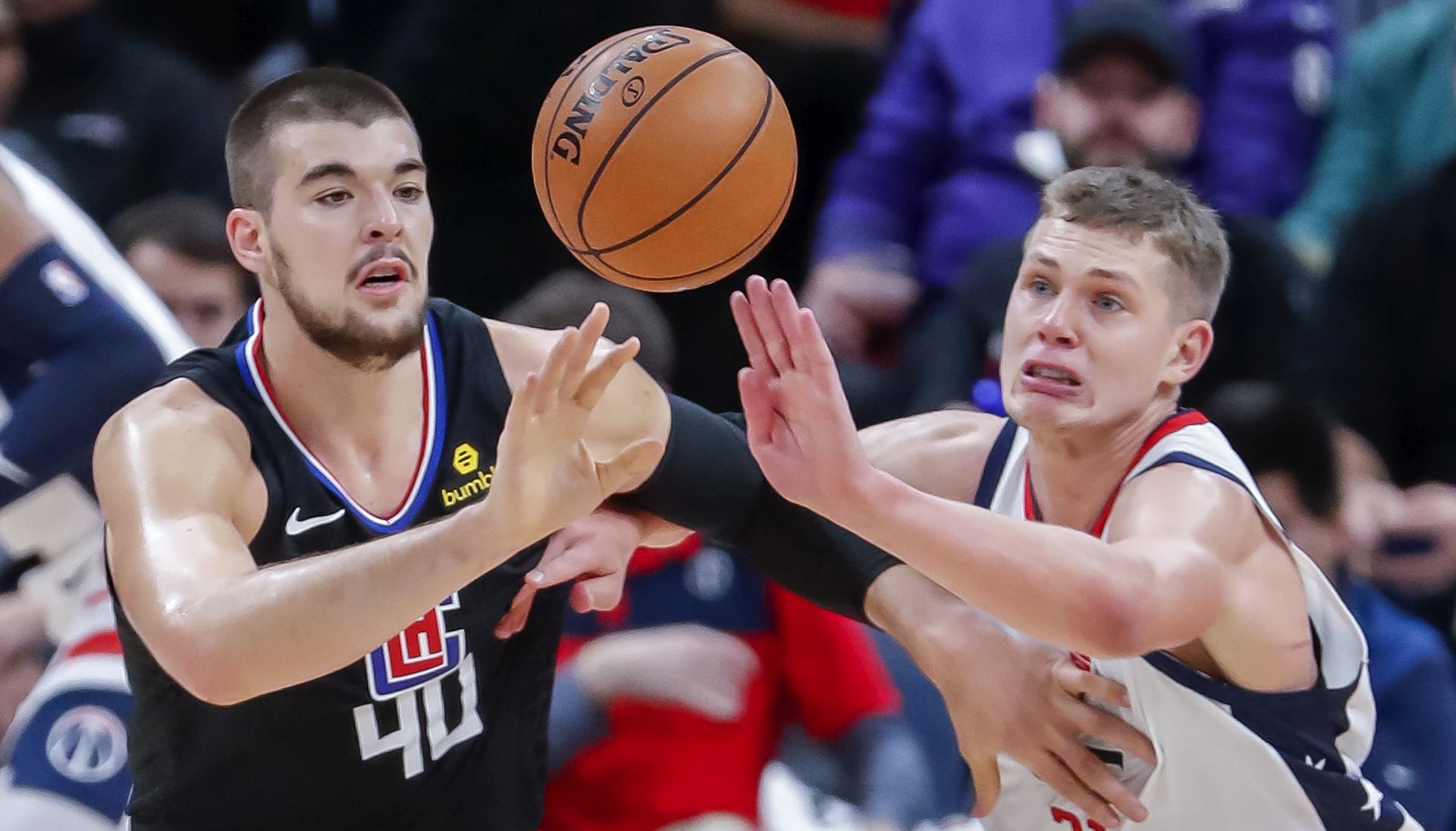 epa08056053 Los Angeles Clippers center Ivica Zubac (L) of Croatia in action against Washington Wizards forward Moritz Wagner (R) of Germany during the first half of the NBA basketball game between the Los Angeles Clippers and the Washington Wizards at CapitalOne Arena in Washington, DC, USA, 08 December 2019.  EPA/ERIK S. LESSER SHUTTERSTOCK OUT