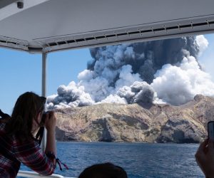 epa08056479 An image provided by visitor Michael Schade shows White Island (Whakaari) volcano, as it erupts, in the Bay of Plenty, New Zealand, 09 December 2019. According to police, at least five people have died in the volcanic erruption at around 2:11 pm local time on 09 December. The island is located around 40km offshore of the Bay of Plenty.  EPA/MICHAEL SCHADE MANDATORY CREDIT: MICHAEL SCHADE  EDITORIAL USE ONLY/NO SALES