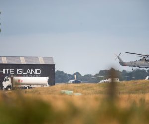 epa08066523 A military helicopter departs Whakatane airport during a recovery operation to retrieve the remaining bodies on White Island following its eruption in Whakatane, New Zealand, 13 December 2019.  EPA/DAVID ROWLAND AUSTRALIA AND NEW ZEALAND OUT