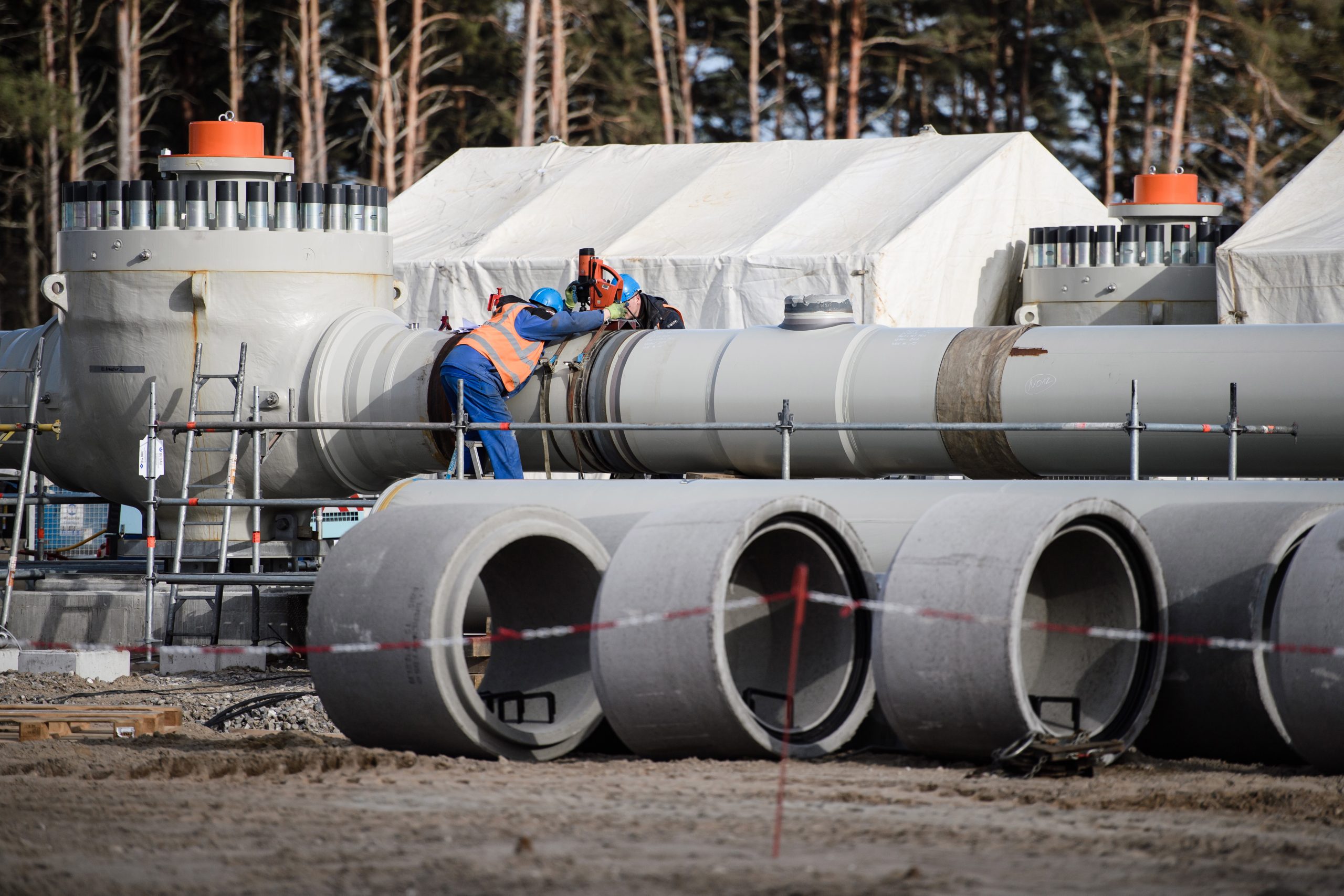 epa08066455 (FILE) - Workers work on a pipeline tube on the construction site of the Nord Stream 2 pipeline in Lubmin, Germany, 26 March 2019 (reissued 12 December 2019). The Nord Stream 2 pipeline with its length of 1230 kilometers runs from the Russian Baltic coast to Germany, subsea. The US House of Representatives has introduced sanctions against companies and individuals involved in the Nord Stream 2 pipeline project.  EPA/CLEMENS BILAN