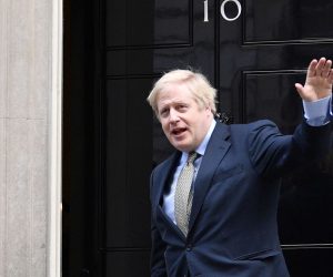 epa08068497 British Prime Minister Boris Johnson returns to 10 Downing Street after a meeting with the Queen in London, Britain, 13 December 2019. Britons went to the polls for a general election on 12 December 2019, which the Conservative Party led by Johnson has won with an overall majority.  EPA/NEIL HALL