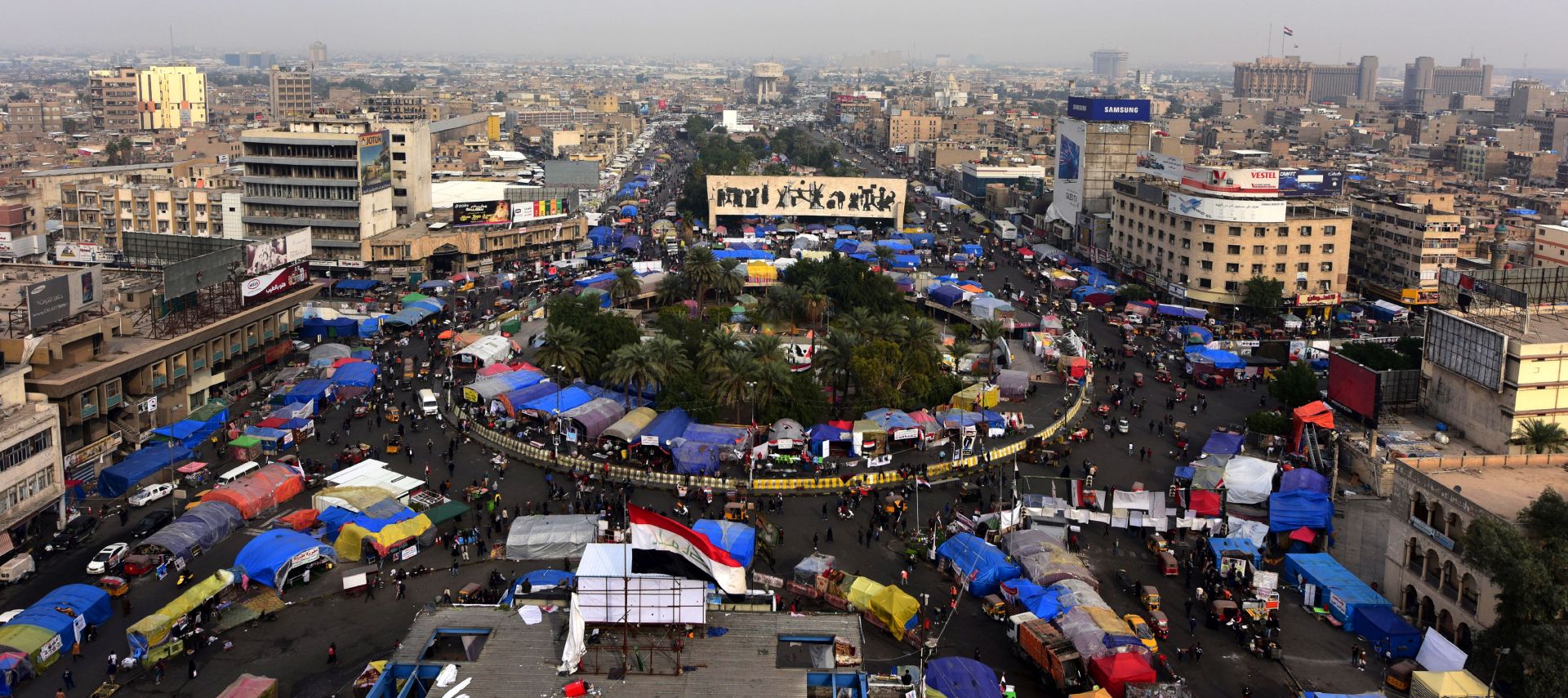 epaselect epa08075907 Iraqi protesters gather during the ongoing protests at the Al Tahrir square in central Baghdad, Iraq, 16 December 2019. Protests continue in Baghdad and southern Iraqi cities since October 2019 with rising casualties of more than 300 people, while protesters are calling for the resignation of all senior officials in the country after Prime Minister Adel Abdul Mahdi stepped down.  EPA/MURTAJA LATEEF