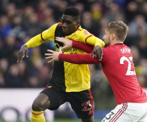epa08086871 Watford's Ismaila Sarr (L) vies for the ball against Manchester United's Luke Shaw (R) during the English Premier League soccer match between Watford and Manchester United at Vicarage Road Stadium, London Britain, 22 December 2019.  EPA/WILL OLIVER EDITORIAL USE ONLY. No use with unauthorized audio, video, data, fixture lists, club/league logos or 'live' services. Online in-match use limited to 120 images, no video emulation. No use in betting, games or single club/league/player publications