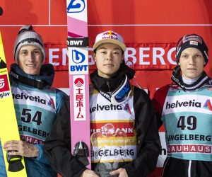 epa08086987 (L-R) Second-placed Peter Prevc of Slovenia, winner Ryoyu Kobayashi of Japan and third-placed Jan Hoerl of Austria celebrate on the podium after the men's ski jumping FIS World Cup event in Engelberg, Switzerland, 22 December 2019.  EPA/ALEXANDRA WEY