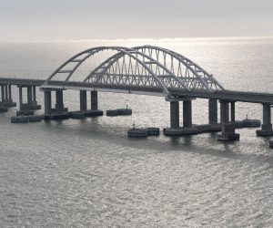 epa08088114 An aerial view of the Krymsky (Crimean) Bridge over the Kerch Strait before the opening ceremony of its railway part , Crimea, 23 December 2019. The 19-kilometers-long road-and-rail bridge connects the Crimean peninsula, annexed by Russia from Ukraine in March 2014, with the Taman Peninsula of the Russian mainland.  EPA/ALEXEY NIKOLSKY / SPUTNIK / KREMLIN POOL MANDATORY CREDIT