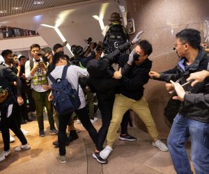 epa08089167 Plain cloth police officers clash with pro-democracy protesters in a shopping mall in Hong Kong, China, 24 December 2019. Police fired multiple rounds of tear gas in the tourist district of Tsim Sha Tsui on Christmas eve, after clashes broke out inside a shopping mall as a large number of protesters join a 'Christmas shopping' rally. Hong Kong has entered its seventh month of mass protests, which were originally triggered by a now withdrawn extradition bill, and have since turned into a wider pro-democracy movement.  EPA/JEROME FAVRE