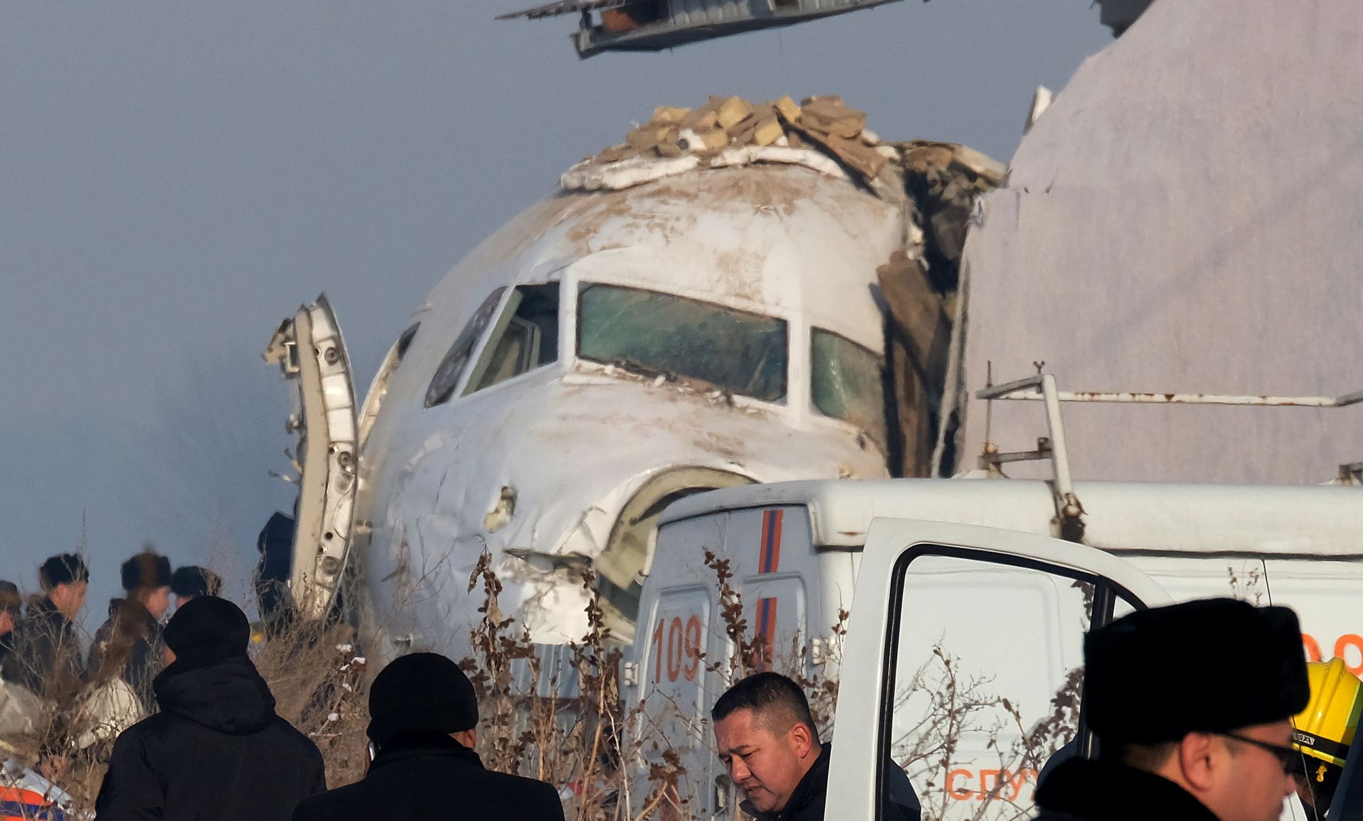 epa08091526 Rescuers work at the site of an airplane crash near Almaty airport, some 20km from the city of Almaty, Kazakhstan, 27 December 2019. According to media reports, at least 14 people have died and over 60 were injured after a Bek Air's Fokker 100 passenger plane with around 100 people on board crashed shortly after taking off from Almaty airport. The flight was en-route from Almaty, the country's largest city, to the capital Nur-Sultan. The cause of the incident is yet unknown.  EPA/VLADIMIR ZAIKIN