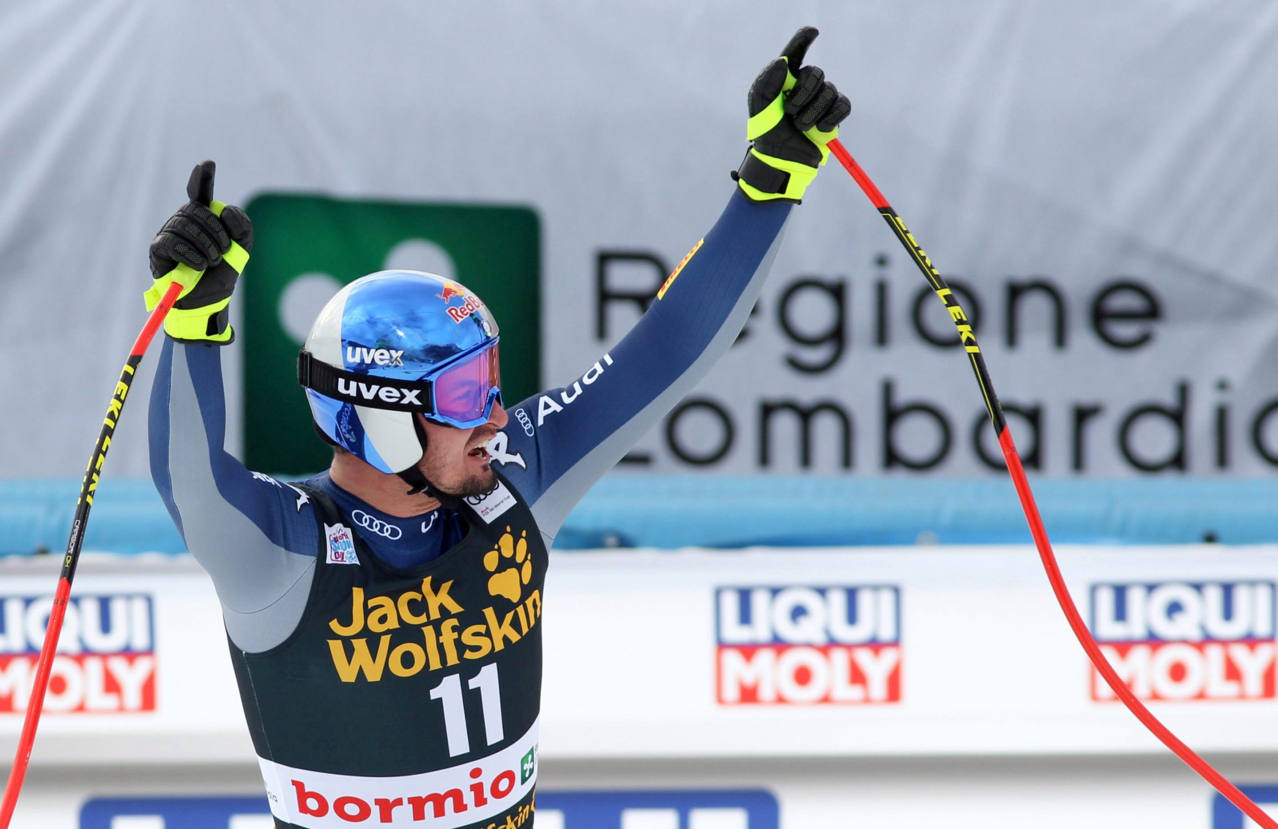 epa08092036 Dominik Paris of Italy celebrates in the finish area after winning the Men's Downhill at the FIS Alpine Skiing World Cup in Bormio, Italy,27 December 2019.  EPA/FELICE CALABRO