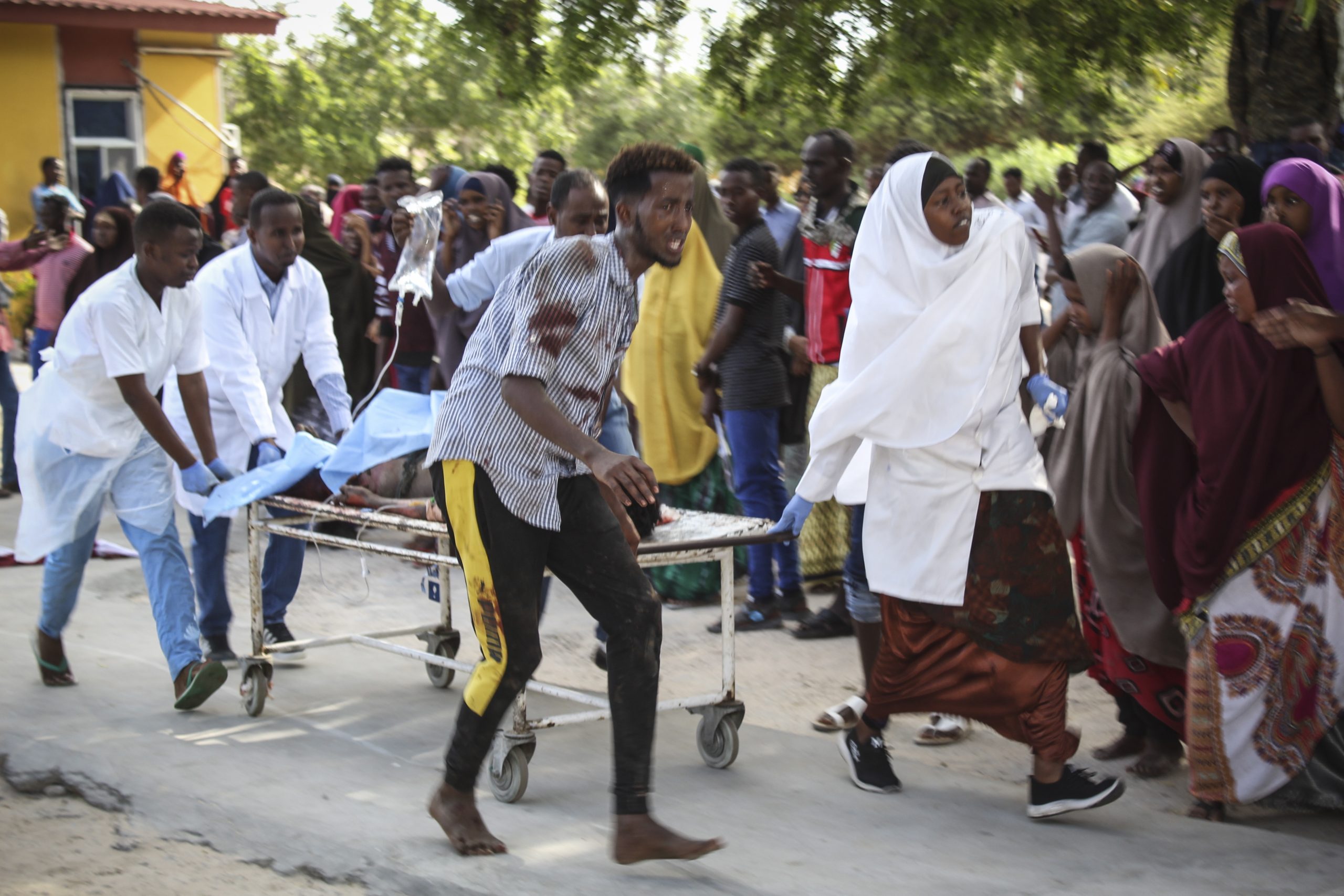 epa08092312 A wounded person is carried on a stretcher at Medina hospital in Mogadishu, Somalia, 28 December 2019. According reports, a large explosion rocked the area near Ex-control Afgoye. Initial police reports said at least five people were killed in what is believed to have been a car bombing.  EPA/SAID YUSUF WARSAME