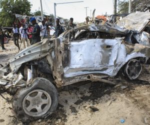 epa08092359 A view of the wreckage of a vehicle at the scene of a large explosion near a check point in Mogadishu, Somalia, 28 December 2019. A source at a hospital said that at least 25 people have been killed in what is believed to have been a car bombing. The explosion rocked an area near the junction called Ex-Control Afgoye, in a southwestern suburb of the capital Mogadishu.  EPA/SAID YUSUF WARSAME