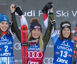 epa08093754 (L-R) Second placed Petra Vlhova of Slovakia,, winner Mikaela Shiffrin of the USA and third placed Michelle Gisin of Switzerland celebrate on the podium for the Women's Slalom race at the FIS Alpine Skiing World Cup in Lienz, Austria, 29 Dezember 2019.  EPA/ANDREAS SCHAAD