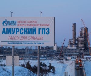 An advertisement billboard is pictured with facilities of Amur gas processing plant under construction in the background, part of Gazprom's Power Of Siberia project outside the far eastern town of Svobodny An advertisement billboard is pictured with facilities of Amur gas processing plant under construction in the background, part of Gazprom's Power Of Siberia project outside the far eastern town of Svobodny, in Amur region, Russia November 29, 2019. Picture taken November 29, 2019. REUTERS/Maxim Shemetov. MAXIM SHEMETOV