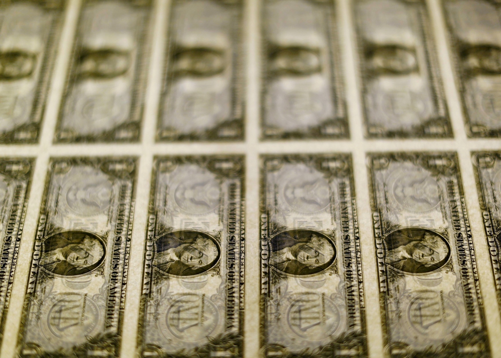 FILE PHOTO: United States one dollar bills seen on a light table at the Bureau of Engraving and Printing in Washington FILE PHOTO: United States one dollar bills are seen on a light table at the Bureau of Engraving and Printing in Washington November 14, 2014. REUTERS/Gary Cameron/File Photo Gary Cameron