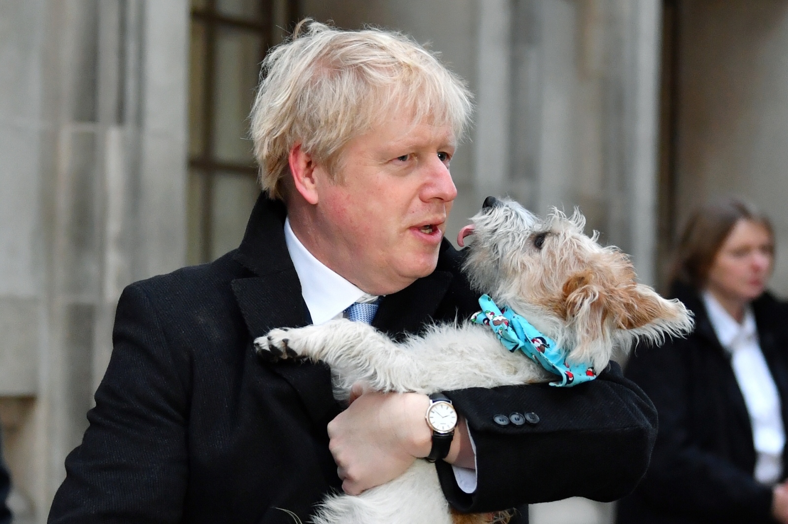 Britain's general election 2019 Britain's Prime Minister Boris Johnson holds his dog Dilyn as leaves a polling station, at the Methodist Central Hall, after voting in the general election in London, Britain, December 12, 2019. REUTERS/Dylan Martinez DYLAN MARTINEZ