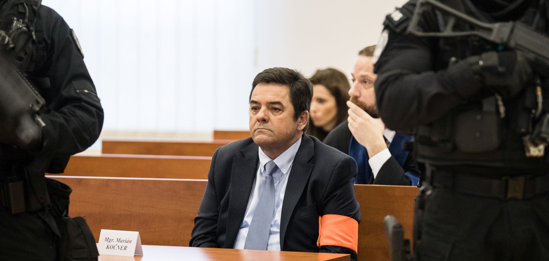 epa08081169 Marian Kocner (C) looks on at the begging of a preliminary hearing of an indictment before the main trial concerning the murder of journalist Jan Kuciak and his fiance Martina Kusnirova in the Judicial Academy building in Pezinok, Slovakia, 19 December 2019. The prosecutor of the Special Prosecutor’s Office filed criminal charges against Marian Kocner, Tomas Szabo, Miroslav Marcek and Alena Zsuzsova on 21 October 2019. The indictment concerns six crimes, including two first-degree murders.  EPA/JAKUB GAVLAK