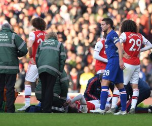 epa08093779 Arsenal's Calum Chambers (C, down) reacts in pain during the English Premier League soccer match between Arsenal FC and Chelsea FC held at the Emirates stadium in London, Britain, 29 December 2019.  EPA/NEIL HALL EDITORIAL USE ONLY.  No use with unauthorized audio, video, data, fixture lists, club/league logos or 'live' services. Online in-match use limited to 120 images, no video emulation. No use in betting, games or single club/league/player publications.