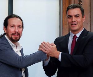 epa08095094 Acting Spanish Prime Minister, Pedro Sanchez (R) and Spanish Podemos Party's leader Pablo Iglesias (L) pose after a meeting to sign a preliminary policy agreement at the Spanish Lower House in Madrid, Spain, 30 December 2019. Spanish Socialist Party and Podemos Party have reached a deal to form a coalition government that is still pending the support of Catalan pro-independence party Esquerra Repulicana (ERC) to abstain in the voting and thus invest Sanchez.  EPA/JuanJo Martin
