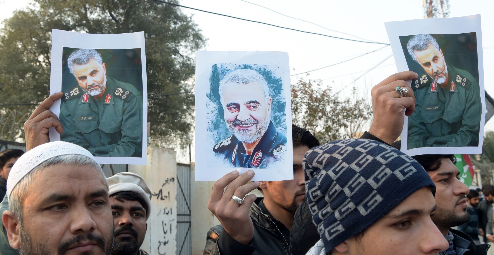 epa08100299 Pakistani Shi'ite Muslims hold pictures of General Qasem Soleimani, the head of Iran's Islamic Revolutionary Guard Corps' elite Quds Force, during a protest against the USA, in Peshawar, Pakistan, 03 January 2020. General Qasem Soleimani, was killed in an airstrike on 03 January, in Baghdad ordered by the United States president, the Pentagon said. General Soleimani was in charge of Iran's foreign policy strategy as the head of the Quds Force, an elite wing of the Islamic Revolutionary Guard Corps, which the US designated as a terror organization. The Quds Force holds sway over a raft of Shia militias across the region, from Lebanon to Syria and Iraq.  EPA/SOHAIL SHAHZAD