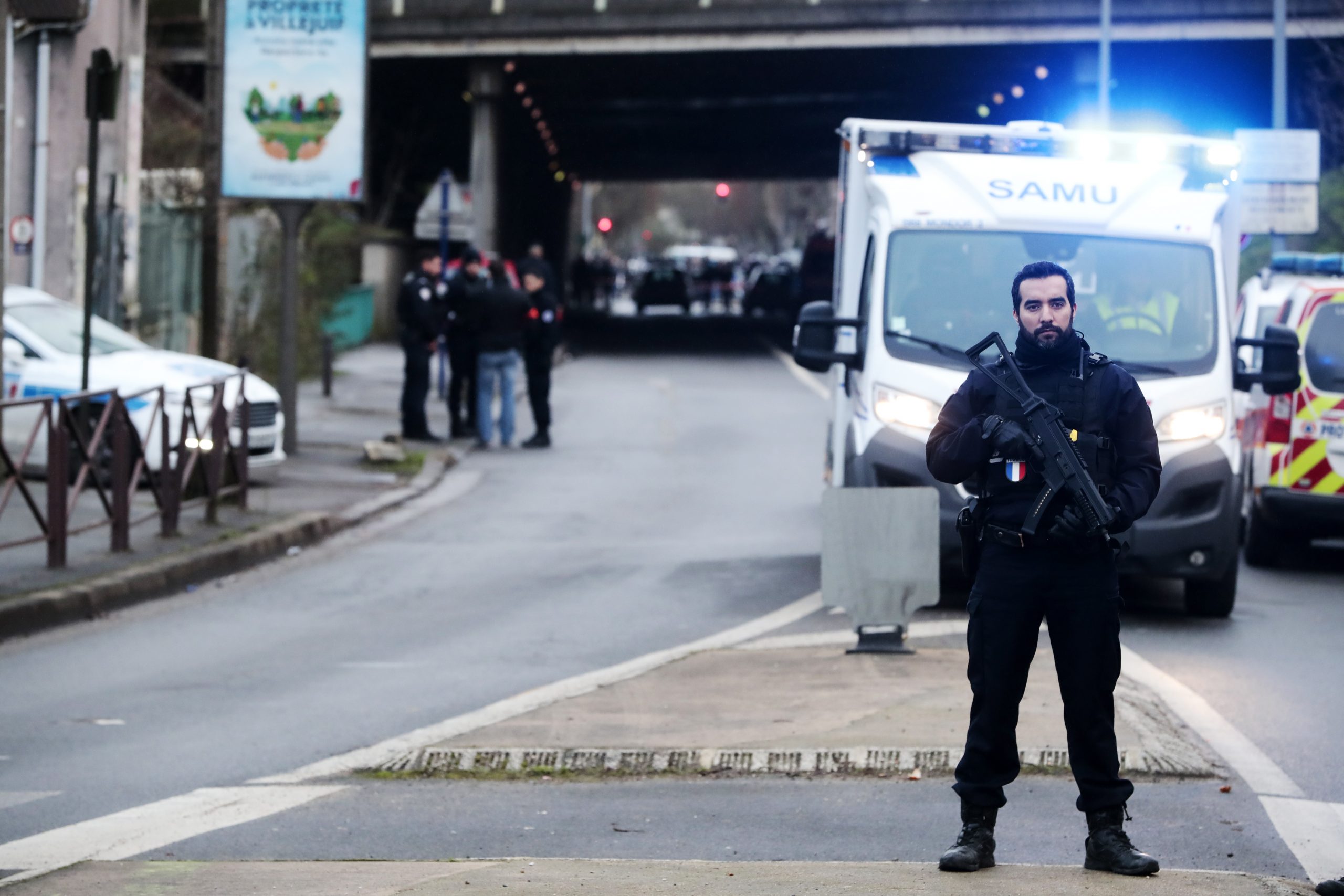 epa08100395 French police and rescue team stand at a security perimeter at the Hautes-Bruyeres public park in Villejuif, near Paris, France, 03 January 2020, after a man stabbed several people. According to recent reports, one person died, two are seriously injured. Police killed the assailant.  EPA/CHRISTOPHE PETIT TESSON