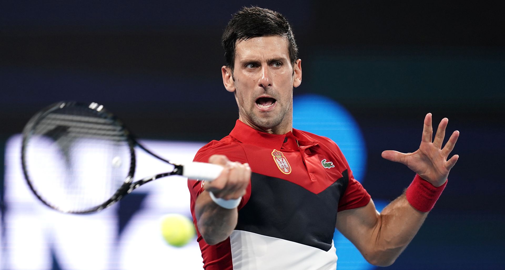 epa08101867 Novak Djokovic of Serbia in action during his singles match against Kevin Anderson of South Africa on day 2 of the ATP Cup tennis tournament at Pat Rafter Arena in Brisbane, Australia, 04 January 2020.  EPA/DAVE HUNT  AUSTRALIA AND NEW ZEALAND OUT  EDITORIAL USE ONLY