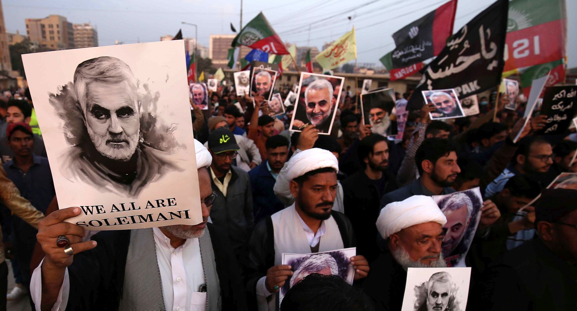 epa08104832 Pakistani Shiite Muslims hold pictures of General Qasem Soleimani, the head of Iran's Islamic Revolutionary Guard Corps' elite Quds Force, during a protest against the USA, in Karachi, Pakistan, 05 January 2020. General Qasem Soleimani, was killed in an airstrike on 03 January, in Baghdad ordered by the United States president, the Pentagon said. General Soleimani was in charge of Iran's foreign policy strategy as the head of the Quds Force, an elite wing of the Islamic Revolutionary Guard Corps, which the US designated as a terror organization. The Quds Force holds sway over a raft of Shia militias across the region, from Lebanon to Syria and Iraq.  EPA/SHAHZAIB AKBER