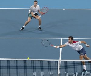 epa08106637 Ivan Dodig (R) and Nikola Mektic (L) of Croatia in action against Poland during the doubles match on day four of the ATP Cup tennis tournament at Ken Rosewall Arena in Sydney, Australia, 06 January 2020.  EPA/CRAIG GOLDING AUSTRALIA AND NEW ZEALAND OUT  EDITORIAL USE ONLY