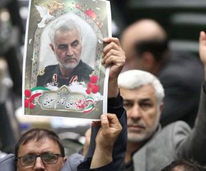 epa08109624 A handout photo made available by the Iranian Parliament officials news agency (ICANA) shows, Iranian lawmakers holding pictures of slain Iran's Quds Force leader Qasem Soleimani as they chant 'death to America', during a parliament session in Tehran, Iran, 07 January 2020. Media reported that Iranian Parliament vote on 07 January 2020, to put the members of the US department of defence 'Pentagon' and their relatives to the terrorist group list. Soleimani was killed in a targeted US airstrike on 03 January 2020 in Baghdad, Iraq.  EPA/ICANA HANDOUT  HANDOUT EDITORIAL USE ONLY/NO SALES