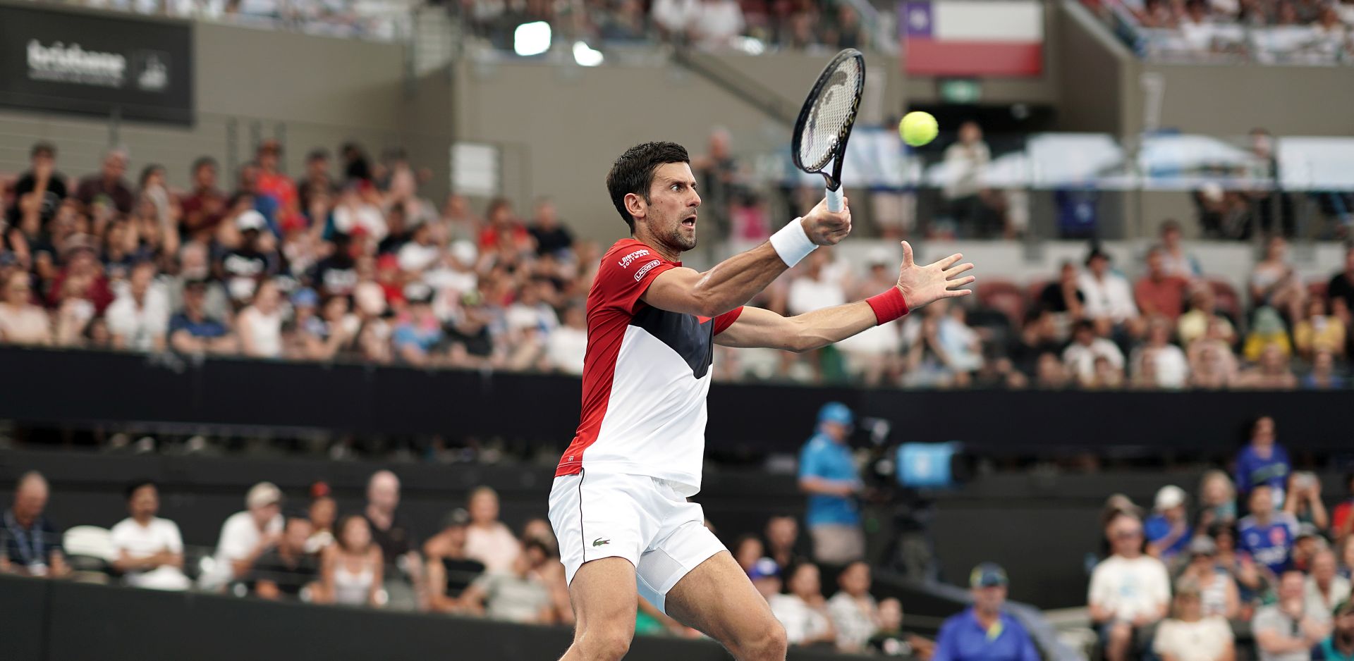 epa08111430 Novak Djokovic of Serbia in action against Cristian Garin of Chile (not pictured) during day six of the ATP Cup tennis tournament at Pat Rafter Arena in Brisbane, Australia, 08 January 2020.  EPA/DAVE HUNT AUSTRALIA AND NEW ZEALAND OUT  EDITORIAL USE ONLY