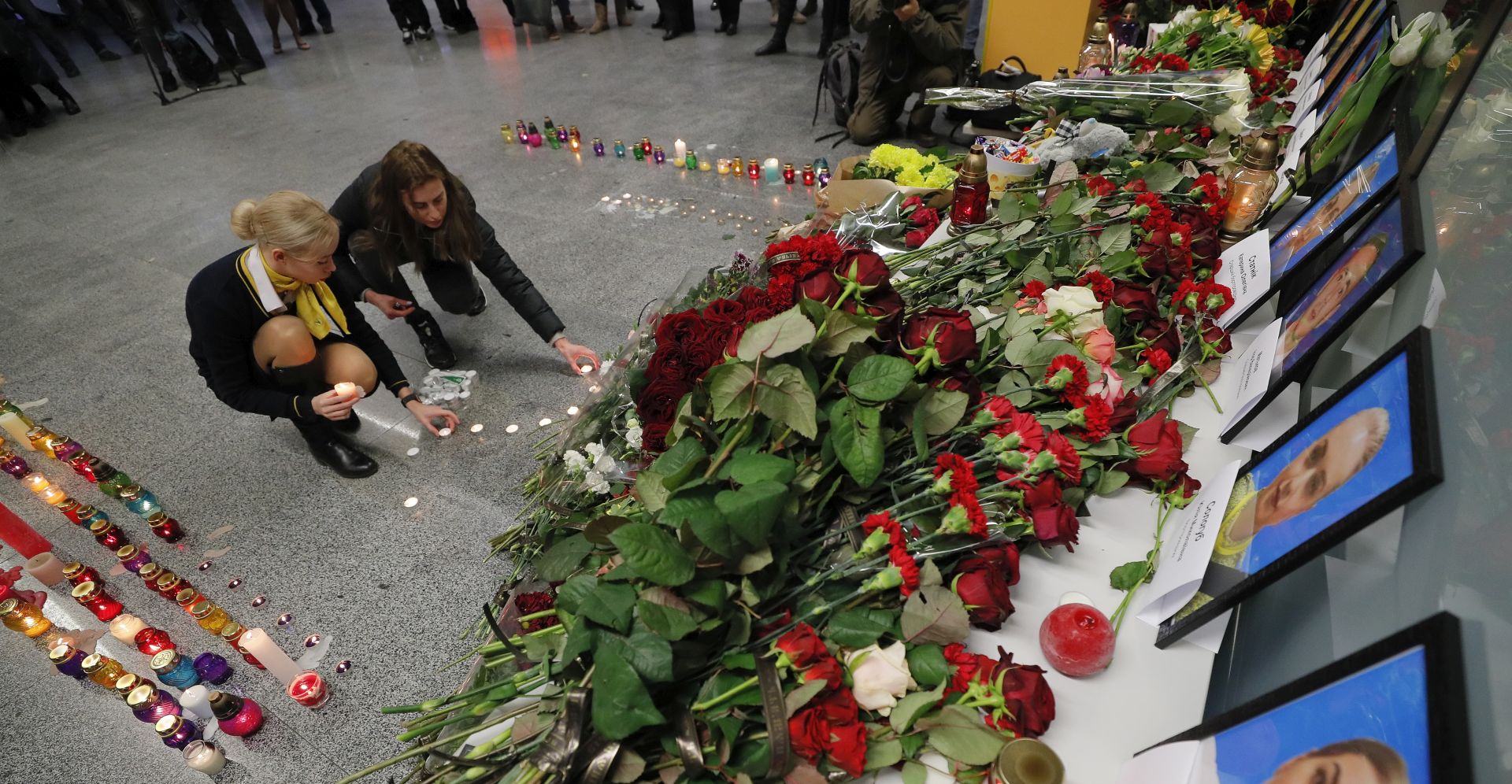 epa08113085 Relatives, colleagues, and friends of crew members of the Ukraine International Airlines Flight PS752 which crashed near Tehran light candles at Boryspil International Airport in Kiev, Ukraine, 08 January 2020. According to media reports on 08 January 2020, a Ukraine International Airlines Boeing 737-800 plane crashed soon after takeoff near Imam Khomeini Airport in Tehran, Iran. Over 170 people were thought to be on the plane, and reports state that all passengers and crew were killed in the crash.  EPA/SERGEY DOLZHENKO