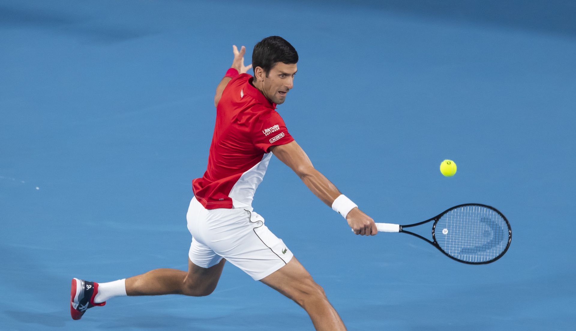 epa08121695 Novak Djokovic of Serbia in action against Rafael Nadal of Spain during the final match on day 10 of the ATP Cup tennis tournament at Ken Rosewall Arena in Sydney, Australia, 12 January 2020.  EPA/CRAIG GOLDING EDITORIAL USE ONLY AUSTRALIA AND NEW ZEALAND OUT