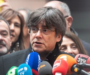epa08124941 Former member of the Catalan government Carles Puigdemont (C) speaks to journalists before his first plenary session as members of the European Parliament in Strasbourg, France, 13 January 2020.  EPA/PATRICK SEEGER