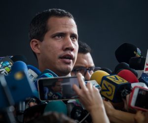 epa08131376 Venezuelan opposition leader Juan Guaido speaks with journalists before the start of a parliamentary session in an auditorium located in the El Hatillo sector, in eastern Caracas, Venezuela, 15 January 2020. Guaido described the events that occured on 15 January around the National Assembly (AN, Parliament) as a takeover of the seat of the Legislature executed by 'paramilitaries', which he believes reveals the dictatorship of President Nicolas Maduro.  EPA/Miguel Gutierrez
