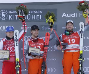 epa08159587 Winner Kjetil Jansrud of Norway (R) joined by second placed Matthias Mayer of Austria (L) and Aleksander Aamodt of Norway (C) pose on the podium after the men's Super G race of the FIS Alpine Skiing World Cup event in Kitzbuehel, Austria, 24 January 2020.  EPA/VALDRIN XHEMAJ