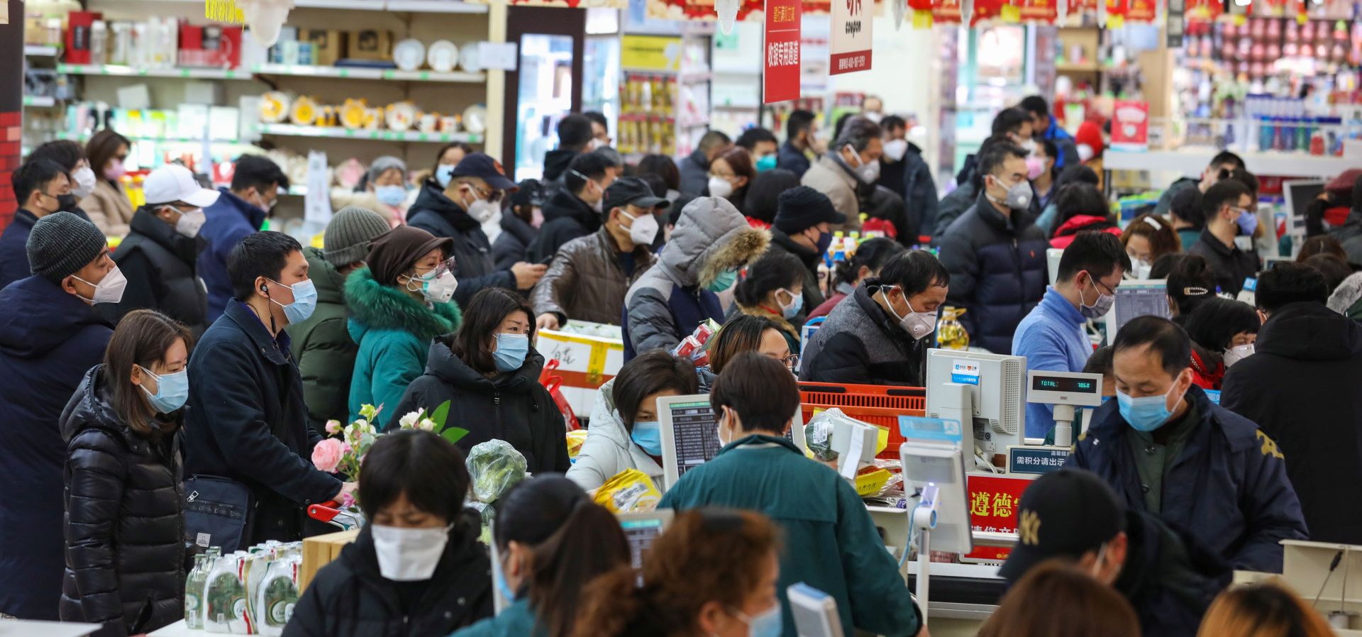 epa08163557 Shoppers wait to check out of a supermarket in Wuhan in central China's Hubei province 25 January 2020. The city struck by the 2019-nCoV virus will ban private traffic starting on Sunday, prompting citizens to a shopping spree of necessities and groceries.  EPA/YUAN ZHENG CHINA OUT