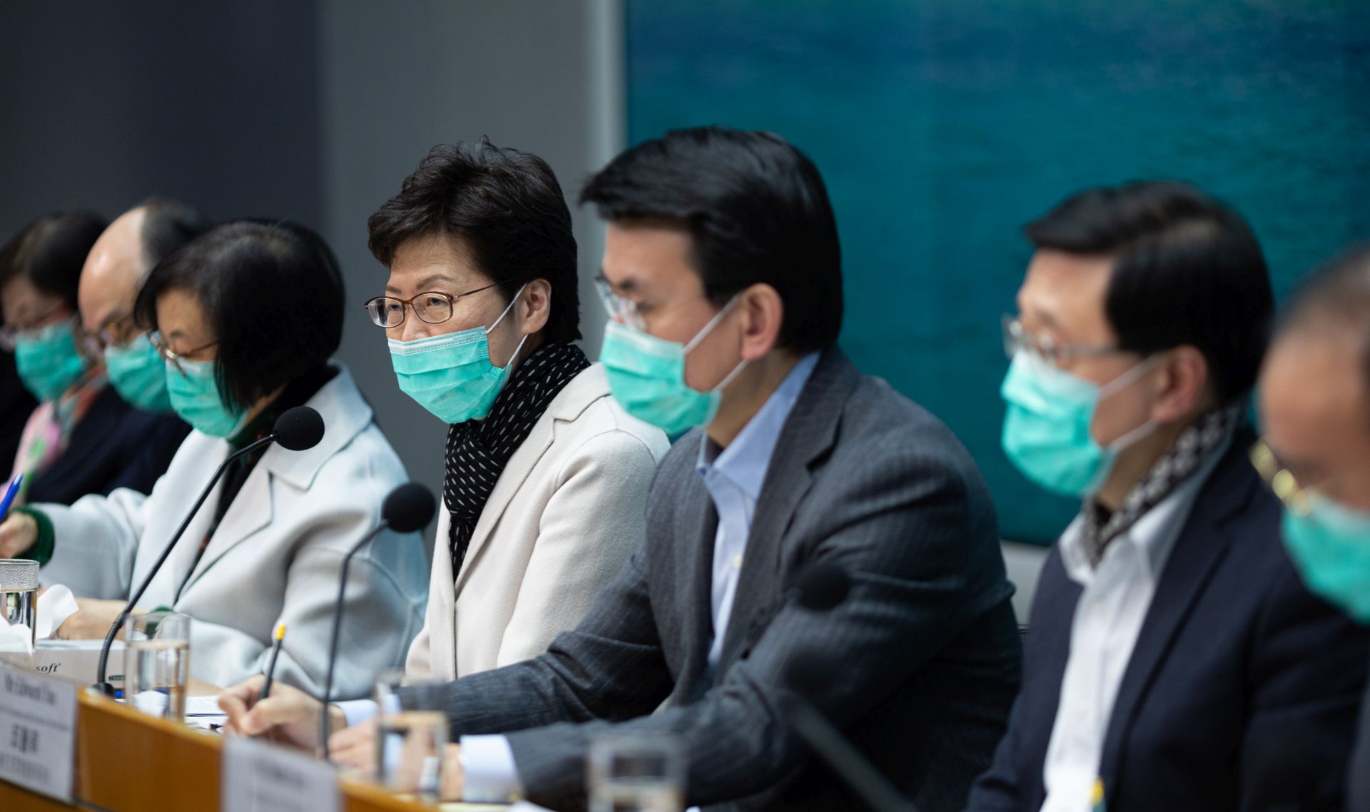 epa08171989 Hong Kong Chief Executive Carrie Lam (C) and cabinet members attend a press conference about the coronavirus outbreak, in Hong Kong, China, 28 January 2020. Lam announced that all rail and ferry routes between mainland China and Hong Kong will be halted starting at midnight on 30 January, but stopped short of a full border closure. The coronavirus has so far killed at least 106 people and infected over four thousand others around the globe, mostly in China.  EPA/JEROME FAVRE