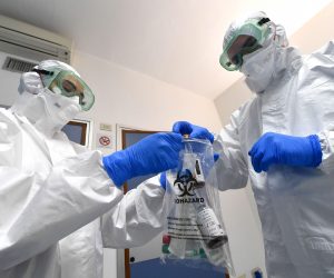 epa08179915 Medical staff of S. Martino hospital infectious disease department, with protective equipment on the isolation room, Genoa, Italy, 30 January 2020. The coronavirus, called 2019-nCoV, originating from Wuhan, China, has spread to all the 31 provinces of China as well as more than a dozen countries in the world. The outbreak of coronavirus has so far claimed at least 170 lives and infected more than 8,000 others, according to media reports.  EPA/LUCA ZENNARO